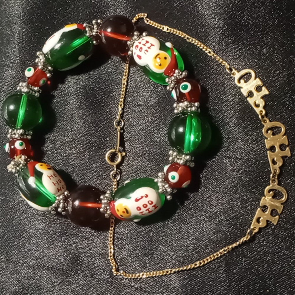 Glass beaded Christmas bracelet and a  gold tone vintage ho ho ho bracelet